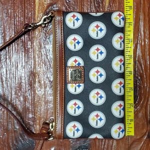 Authentic Dooney & Bourke wristlet.